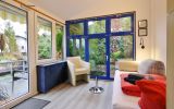 Ferienhaus 'Free Willi' - Wintergarten mit Doppelschlafsofa